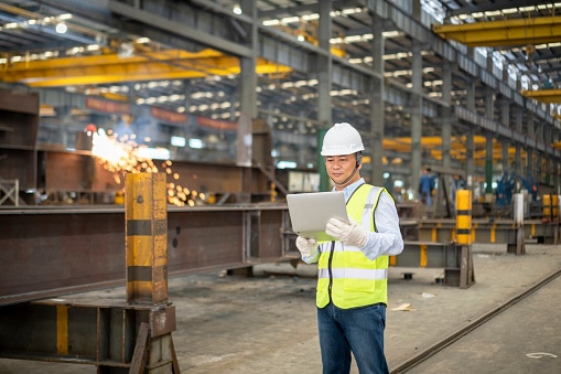 a facilities professional examining analytics on a tablet