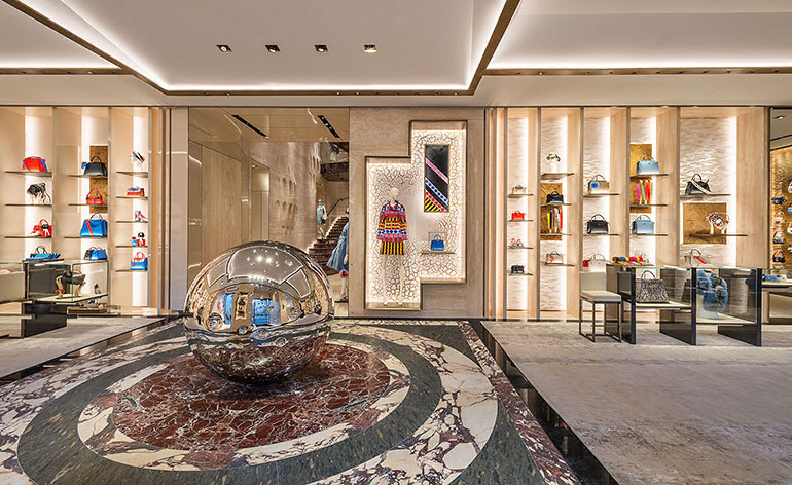 Fendi store interior with large reflective sphere in the center